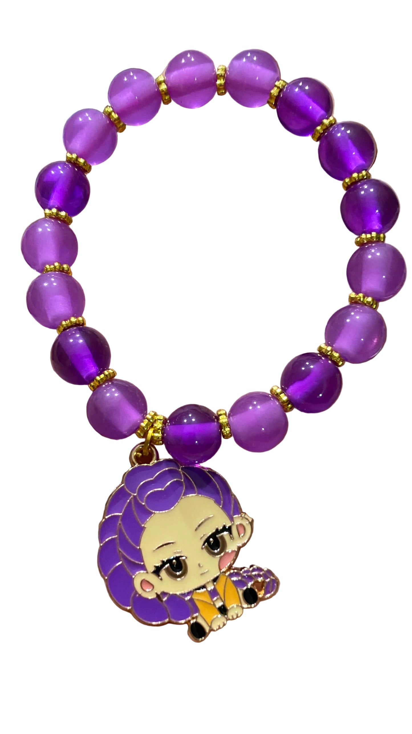 Purple beaded bracelet with a cartoon character charm held in a hand.